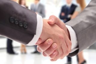 Closeup of two men shaking hands