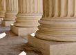 Close up of marble pillars outside of a courthouse