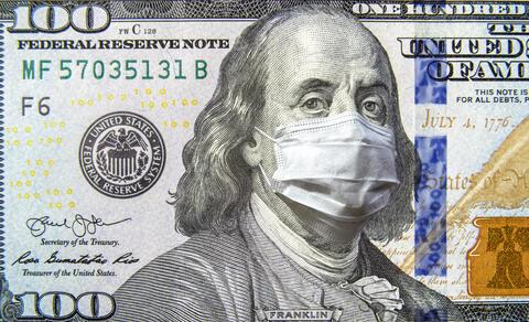 Picture of a one hundred dollar bill with a mask over Benjamin Franklin