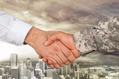 Close up of a man shaking a veterans hand