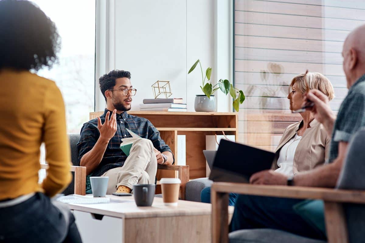 Group of diverse people discussing goals